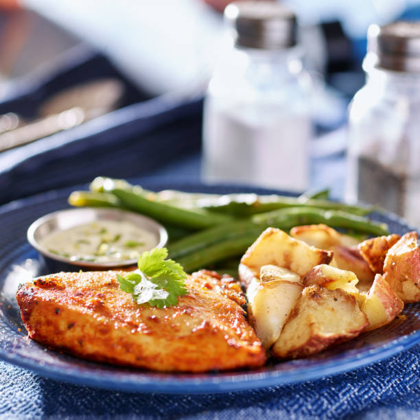 istock baked chicken and green beans with potatoes 825878168