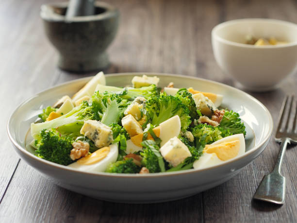 istock Broccoli and eggs salad with blue cheese and walnuts 825878600