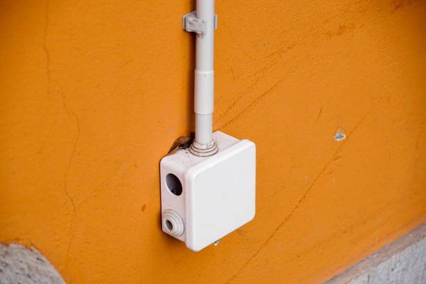 istock electrical box for splicing out door,on yellow wall 825886496