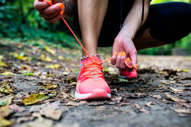 istock Tying sports shoes 825886594
