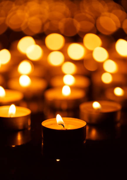 istock Burning candles with shallow depth of field 825887084