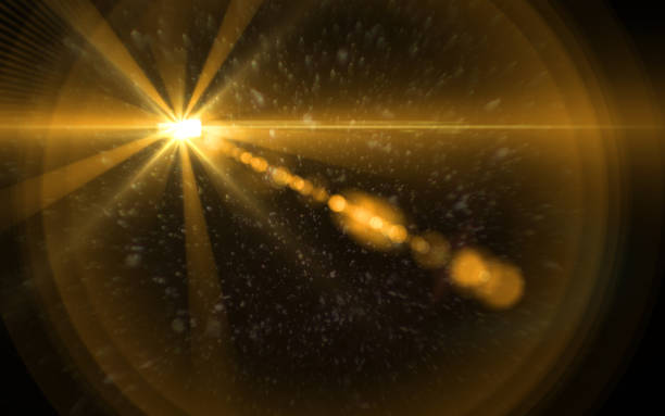 istock Abstract Lens Flare dusty with black background.Modern abstract beautiful rays light streak background.Gold sun light flare effect 825887206