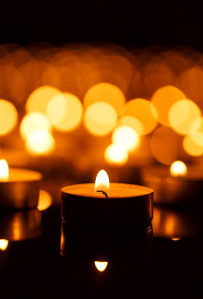 istock Burning candles with shallow depth of field 825887280