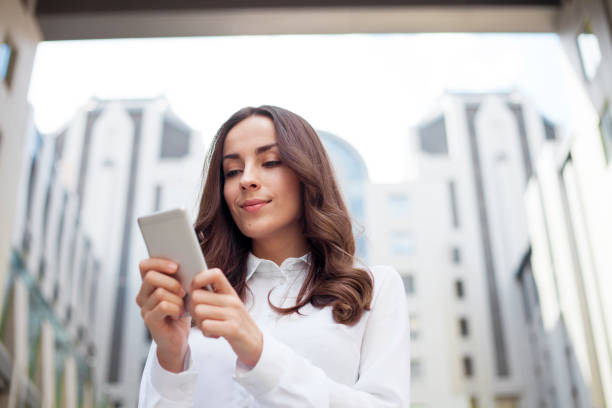 istock Attractive Young business woman is using the phone 825890458