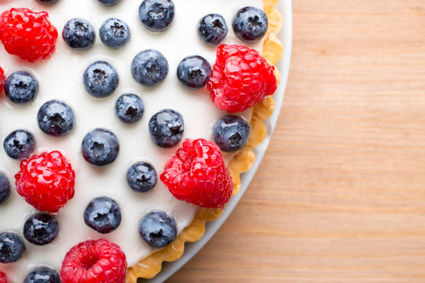istock Cake with blueberries and raspberries. Confectionery product. 825890772