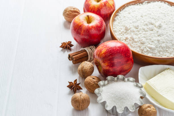 istock Ingredients for baking. Selection for Autumn pie or muffins with Apples and cinnamon, selective focus 825892448