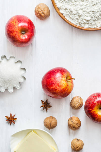 istock Ingredients for baking. Selection for Autumn pie or muffins with Apples and cinnamon, flat lay 825892476