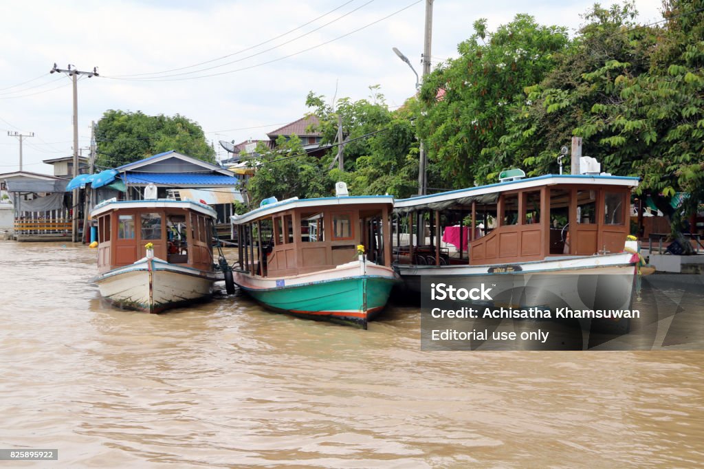 Three wooden Passenger boat in Chao Phraya river. Nonthaburi, Thailand - July 29, 2017 :  They all three passenger boat bring tourists to worship at variety temples on the Chao Phraya river edge. Ancient Stock Photo