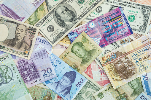 International banknote background for global currencies concept for money exchange business