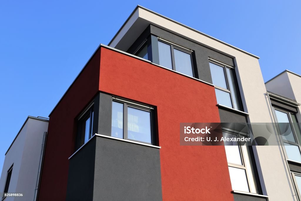 House with modern facade Residential home with modern facade painting, exterior shot Facade Stock Photo