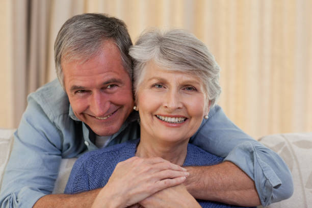 istock Mature man hugging his wife 825899054