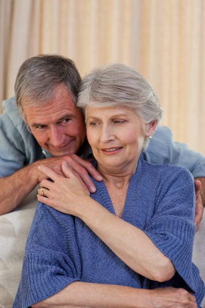 istock Mature man hugging his wife 825899136