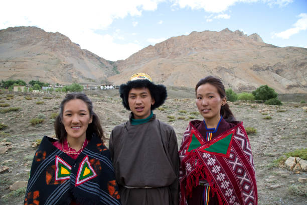istock Buddhist man and women posing in front of mountains 825902692