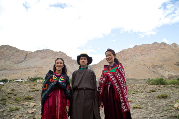 istock Buddhist man and women posing in front of mountains 825902886