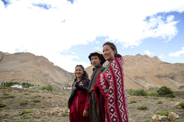 istock Buddhist man and women posing in front of mountains 825902988