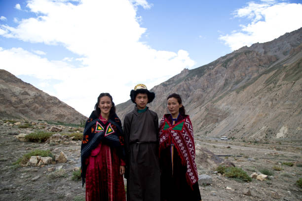 istock Buddhist man and women posing in front of mountains 825903108