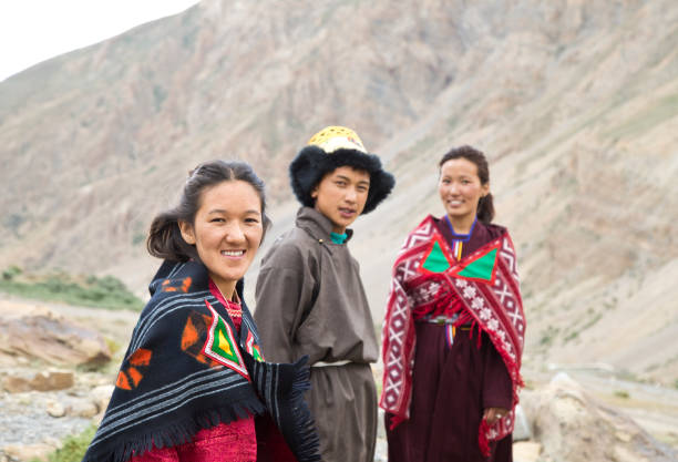 istock Buddhist man and women posing in front of mountains 825903506