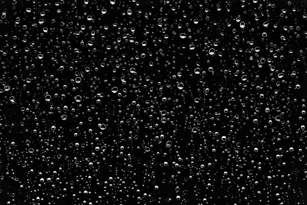 istock Drops of water on a black background 825903508