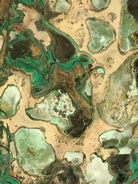 istock malachite nodules in beige rock matrix 825903796