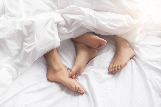 Young couple intimate relationship on bed passion stock photo