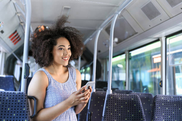 istock Traveling with public transport and using smart phone 825919018