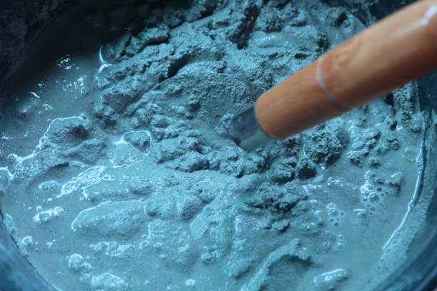 istock Pick up a trowel and cement mix sand. 825919156