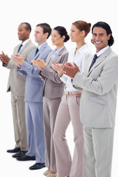 istock Business team smiling and applauding 825921820