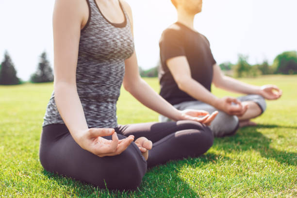 istock People practice acro yoga outdoors healthy lifestyle 825926724