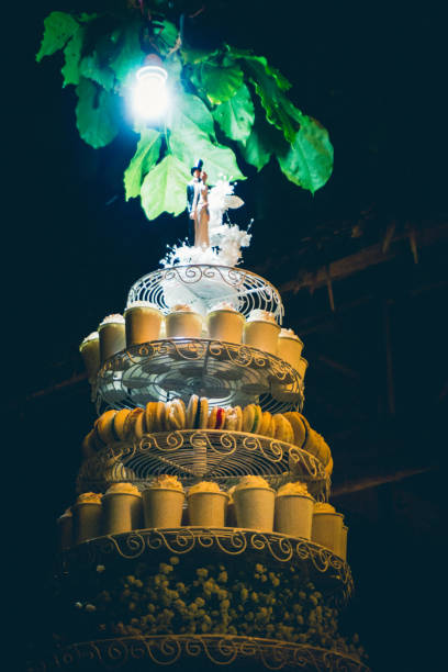 istock Bride and Groom on Wedding Cupcake Tower 825927368