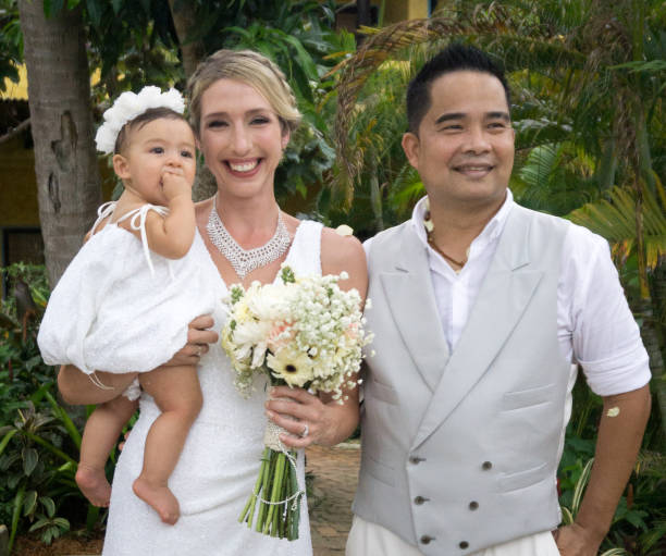 Groom with his brother's family, holding baby