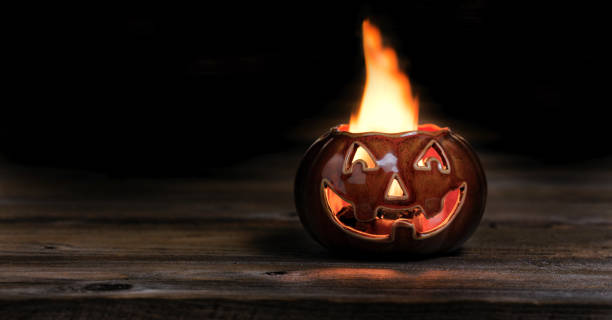 istock Halloween pumpkin on fire during the night time 825941116