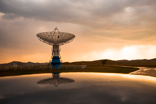 Radio telescope in sunset