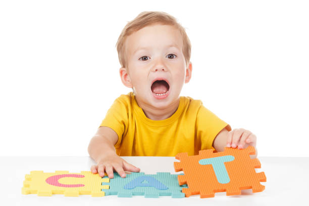 istock Little boy playing with colorful alphabet 825953906