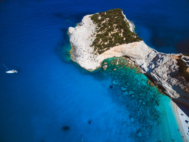 istock Cape and crystal clear Mediterranean sea 825954496