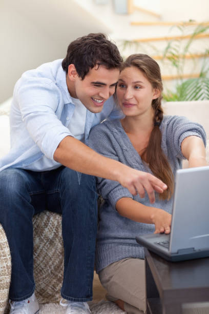 istock Portrait of a surprised couple using a laptop 825955090