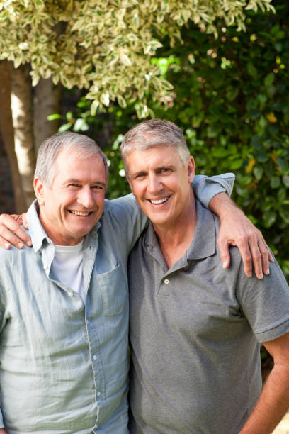 istock Father and his son looking at the camera in the garden 825957588