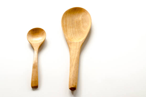 istock Wooden spoon and ladle on the white background 825960908
