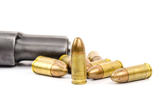 istock Gun and Bullets isolated on the white Background. 825964282