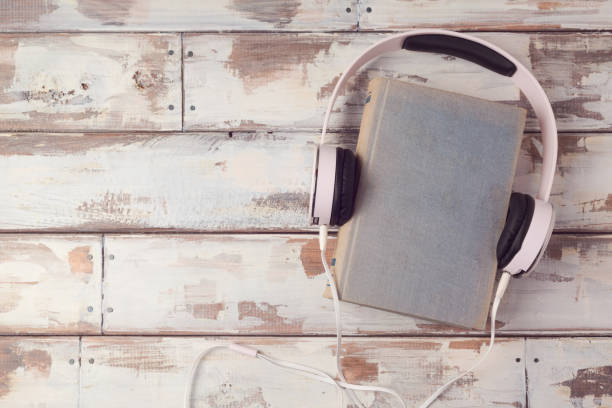 istock Audio book concept with old book and headphones. View from above. Flat lay 825968766