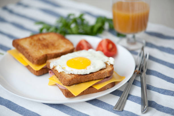 istock Croque Madame - sandwich with ham, cheese and fried egg 825972604