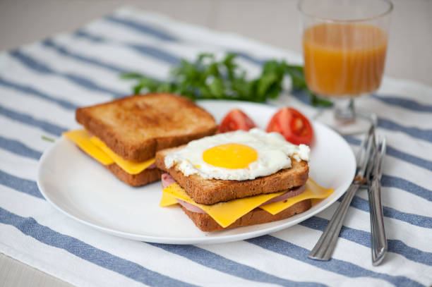 istock Croque Madame - sandwich with ham, cheese and fried egg 825972694