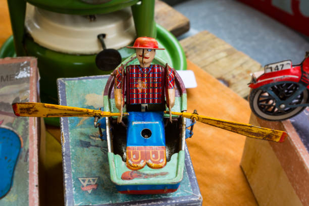 istock Vintage rower tin wind-up toy on flea market 825972782