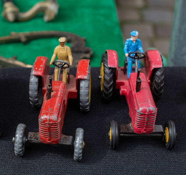 Close up steering wheel of green tractor toy.