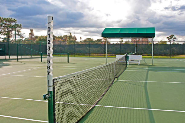istock Tennis court on overcast day 825977518