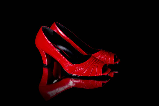 istock Female Red Shoe on Black Background, Isolated Product. 825982172