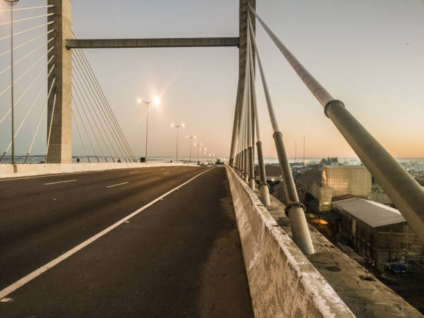 istock Bridge morning road with beautiful sunrise 825985280