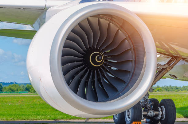 istock Jet engine and wing chassis parked at the airport 825986364