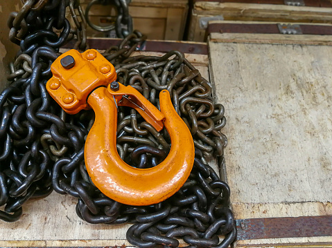 New chain cargo sling. Black steel chain and yellow cargo hooks