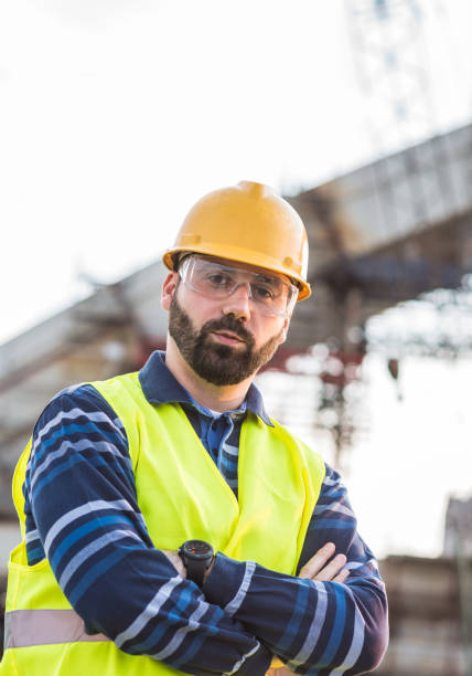 istock Portrait of main engineer with beard on construction site 825992664