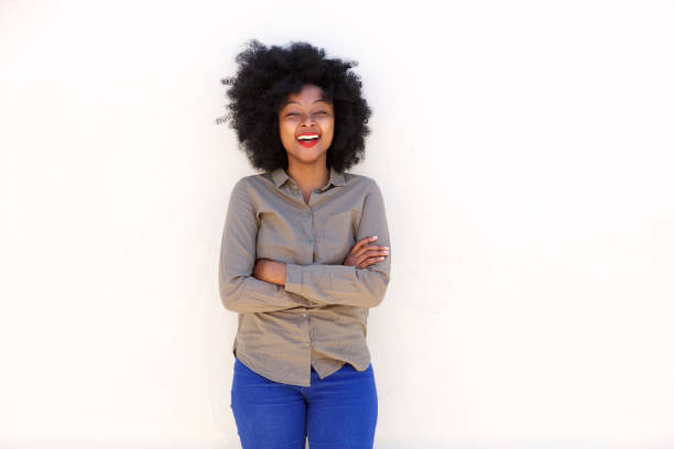 istock confident smiling woman standing against white background 825993036